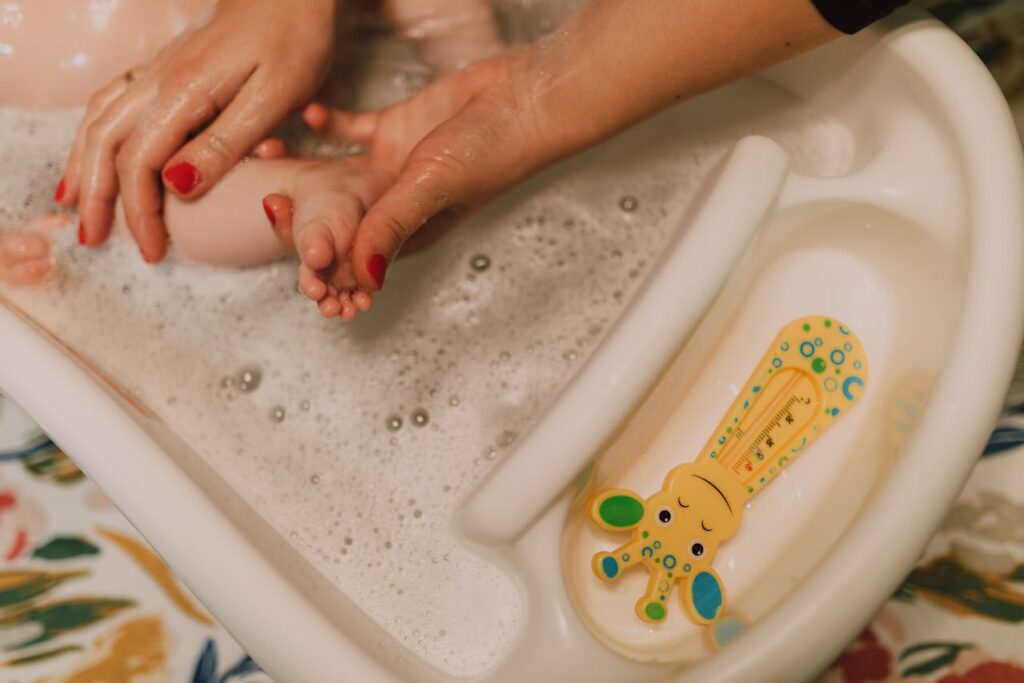 Baby bathing in tub